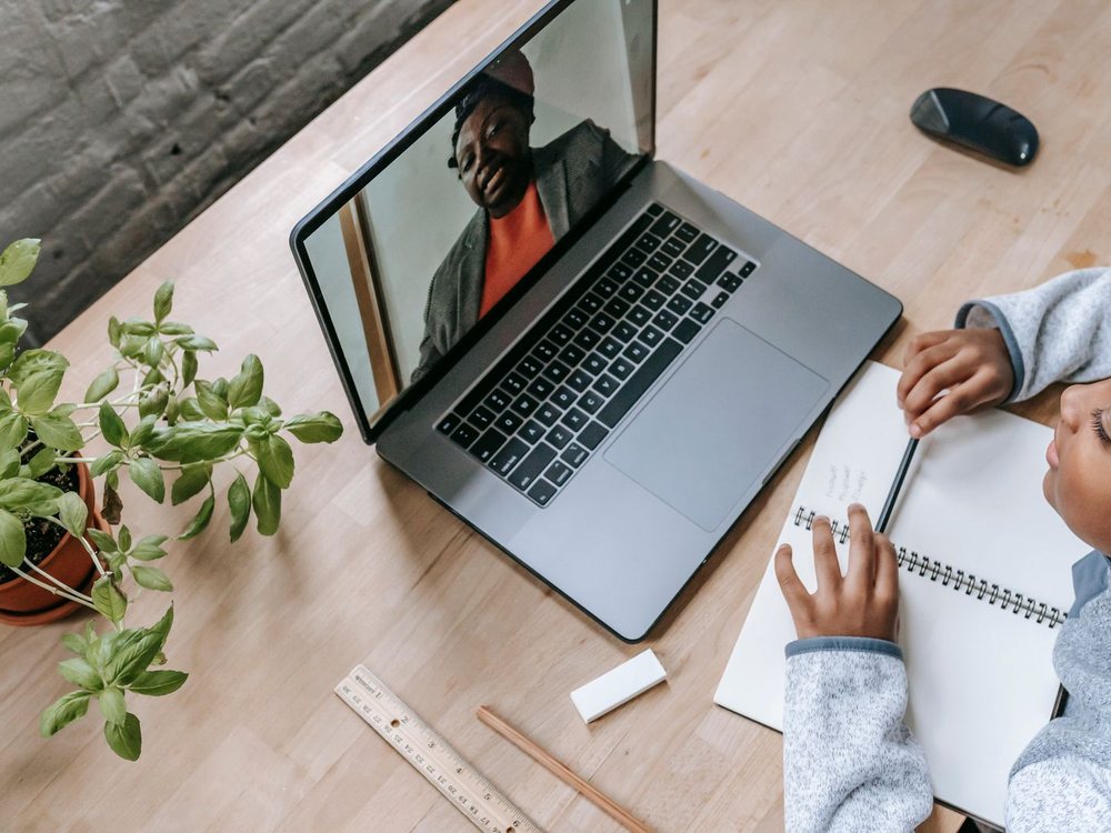 A laptop and notebook set up for online study