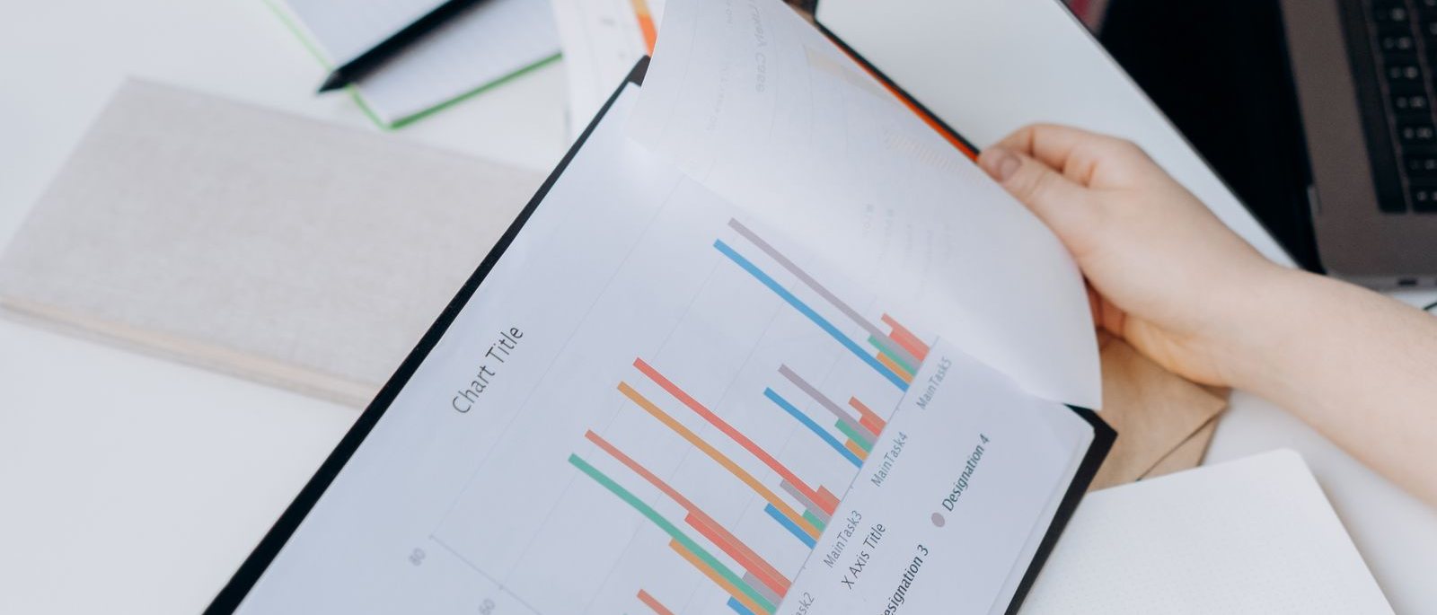 A research report with data charts on a desk